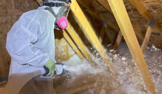 Spraying Foam Insulation in Attic