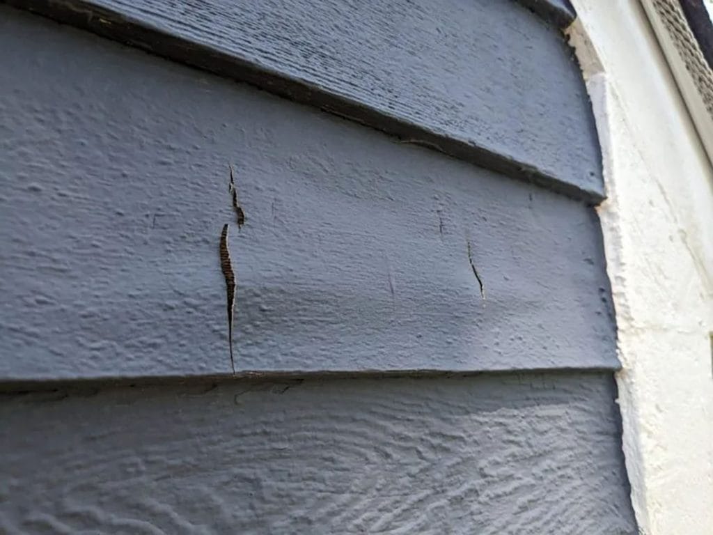 Paint Peeling from Wood Siding Due to Temperature Changes