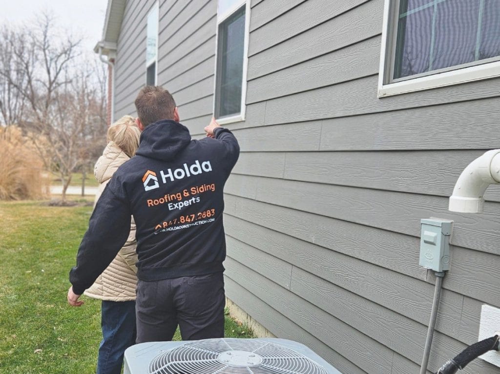 Mariusz Pointing Out Cracked Window Caulk
