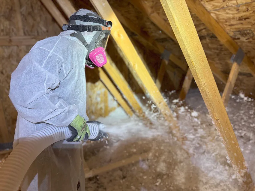 Spraying Foam Insulation in Attic